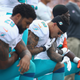 Kenny Stills No. 10 of the Miami Dolphins (center) kneels during the national anthem before the game against the New England Patriots at Gillette Stadium on Sept. 18, 2016, in Foxboro, Mass.
Maddie Meyer/Getty Images